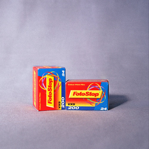 Two boxes of FotoStop 200 film on a gray background