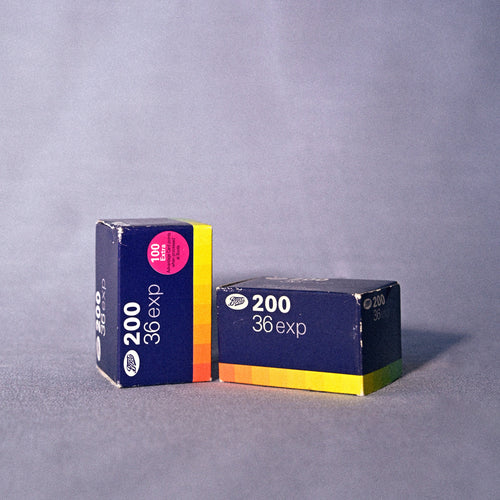 Two boxes of 35mm film with '200' and '36 exp' text on a gray background