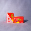 Two boxes of film with red and white design on a gray background