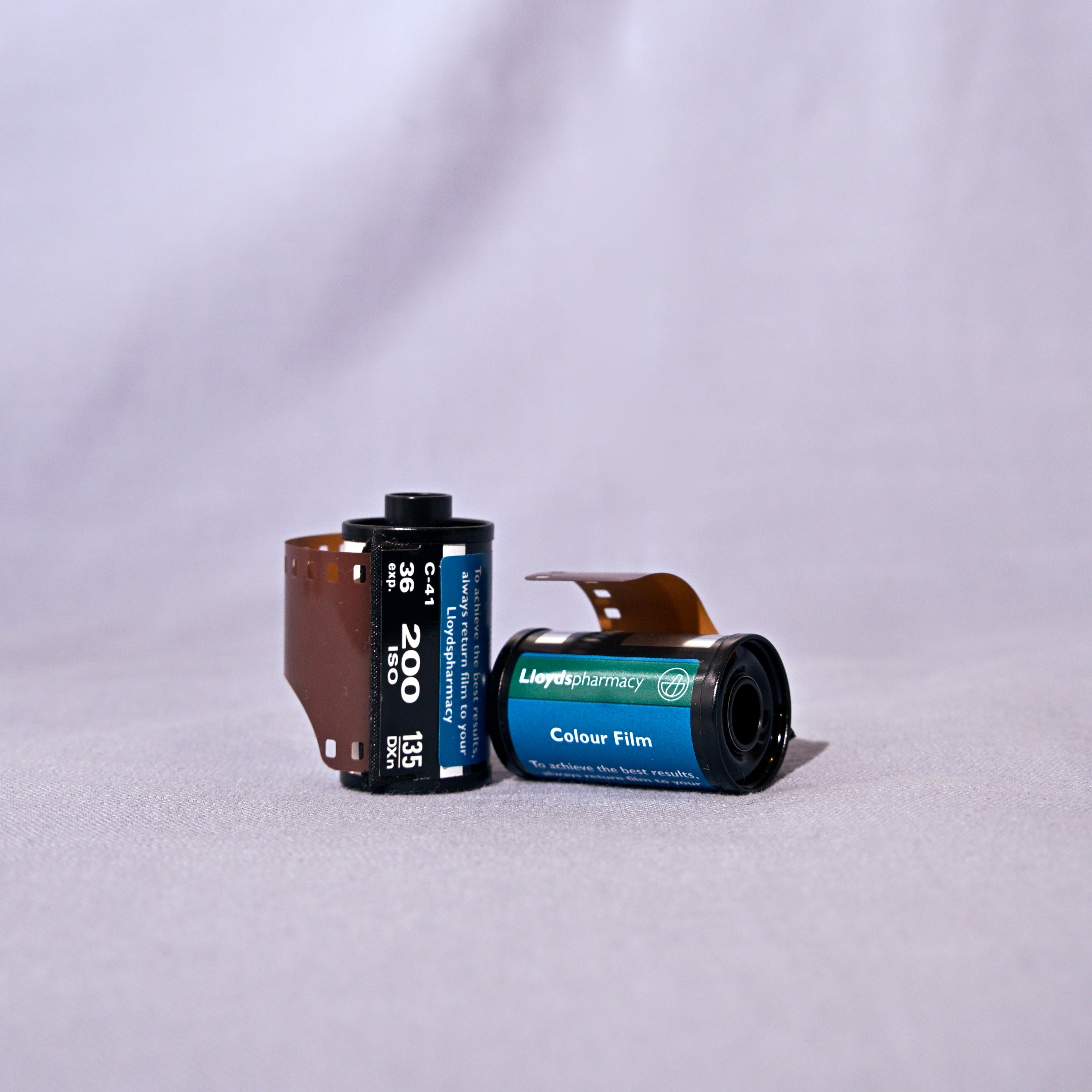 Two rolls of film on a light gray background