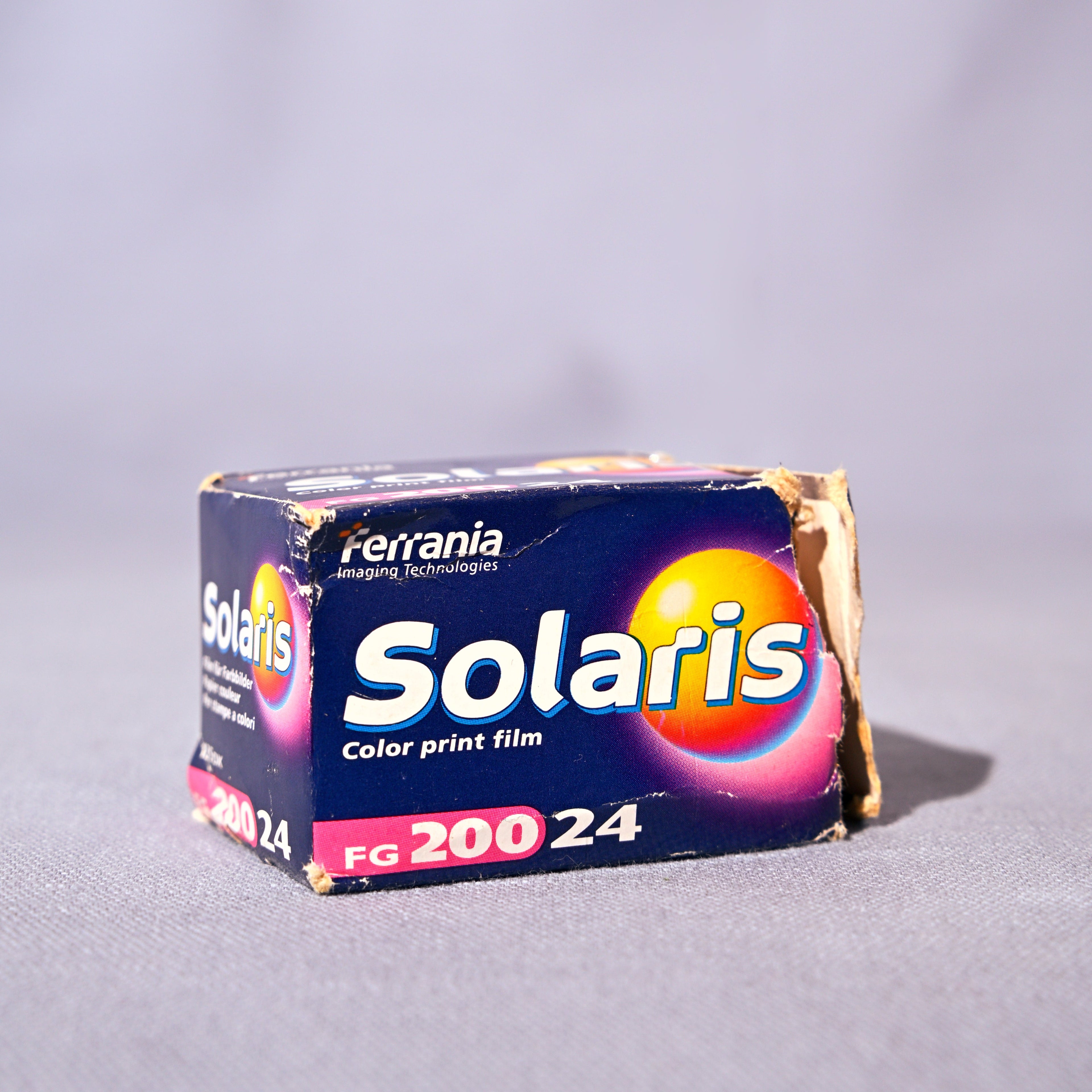 Box of Solaris color print film on a gray background