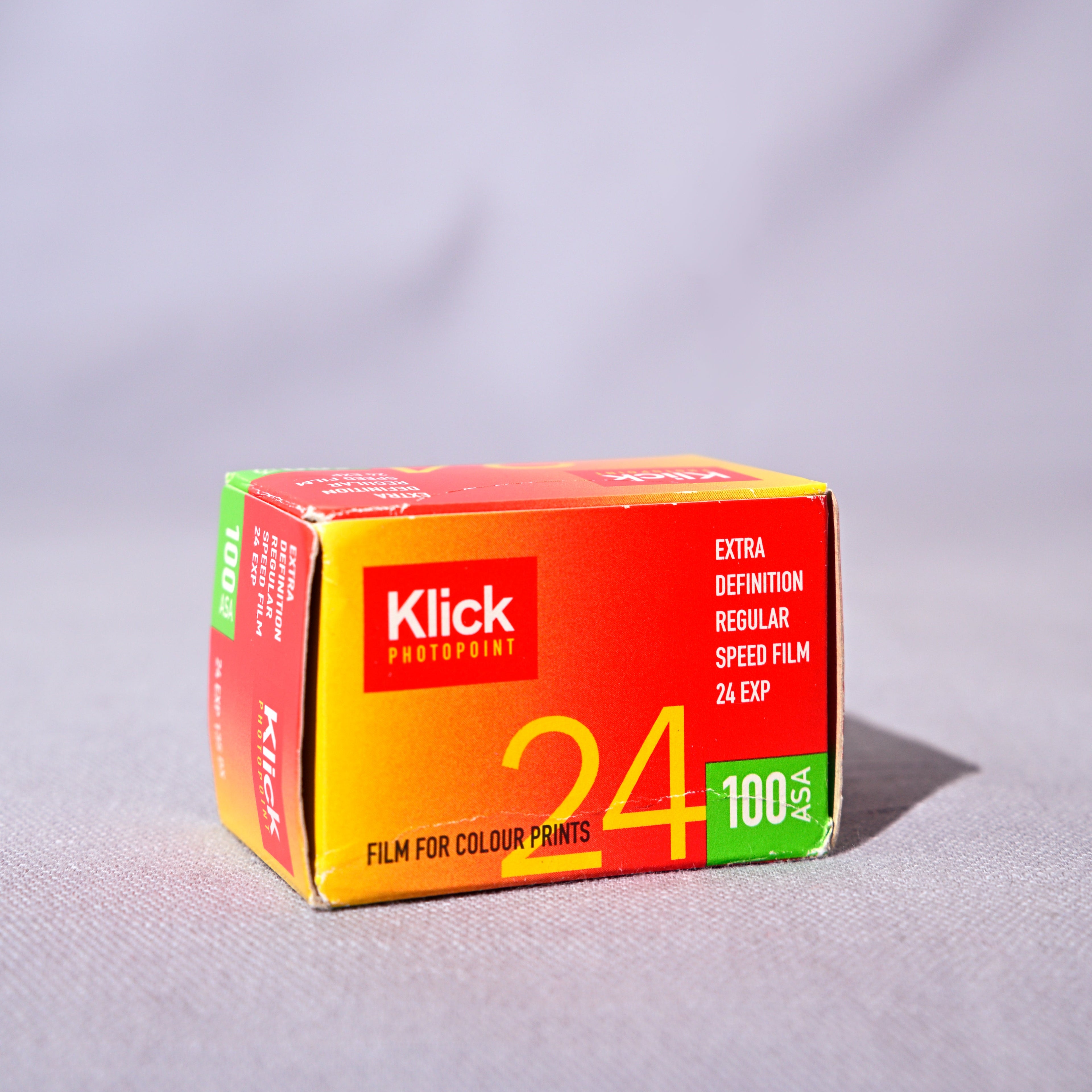 Klick film packaging on a gray background