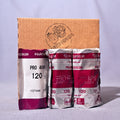 Three Fujicolor Pro 400 film packs, including one larger pack and two smaller packs, arranged in front of a brown cardboard box on a light gray fabric background.